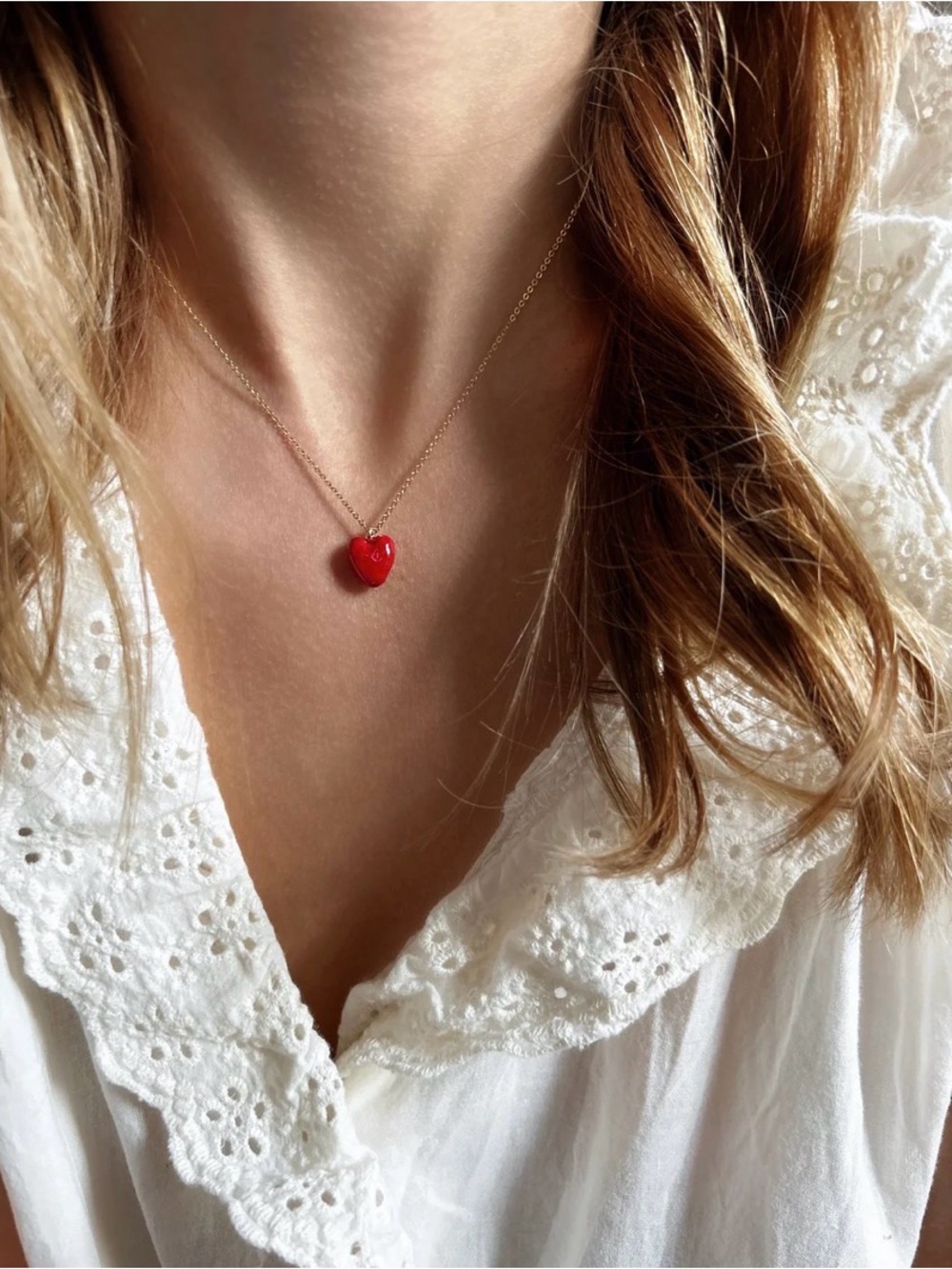 elise tsikis necklace with red heart pendant